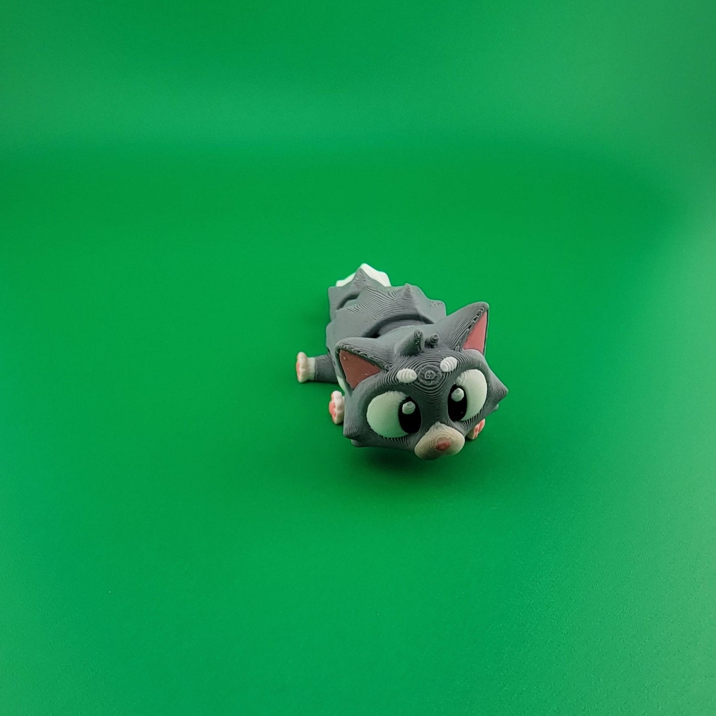 The Ultimate furry companion Cat facing forward on a green background