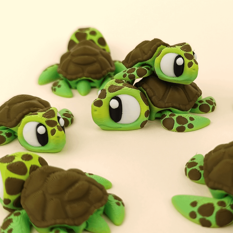 Articulated 3D‑printed sea turtle flexi toy with green shell