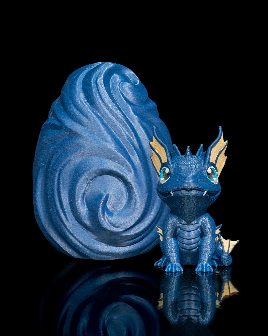 3D printed water dragon figure next to water dragon egg – studio photo