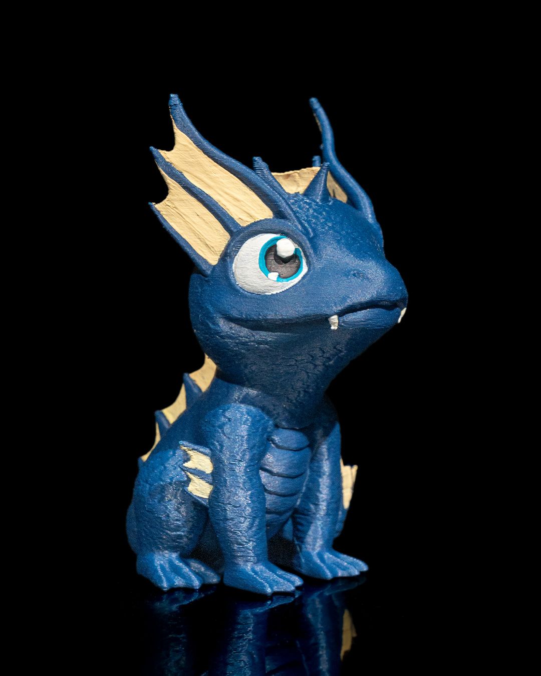 Close-up of 3D printed water dragon figure – face and eye detail