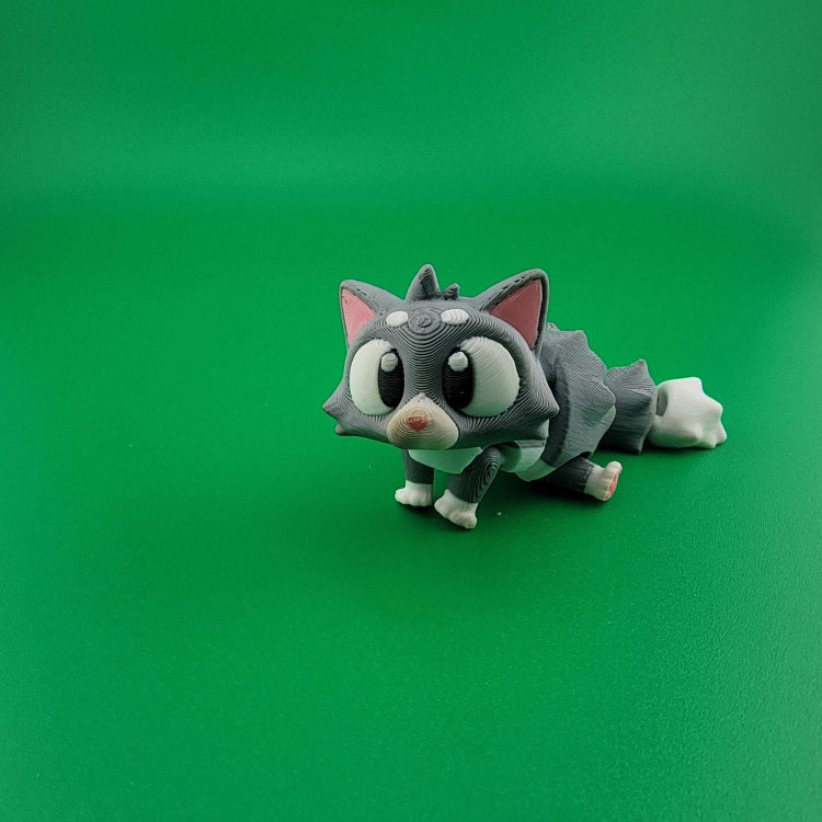 The ultimate furry companion, Articulated toy cat on green background, mess-free pet alternative.
