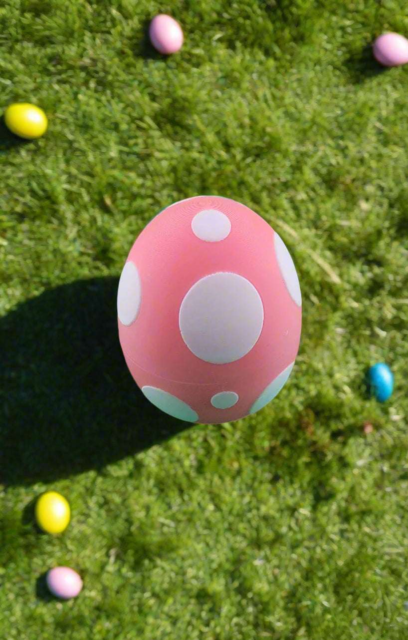 Easter-themed toy egg with white polka dots, part of the Easter Bunny Collection.