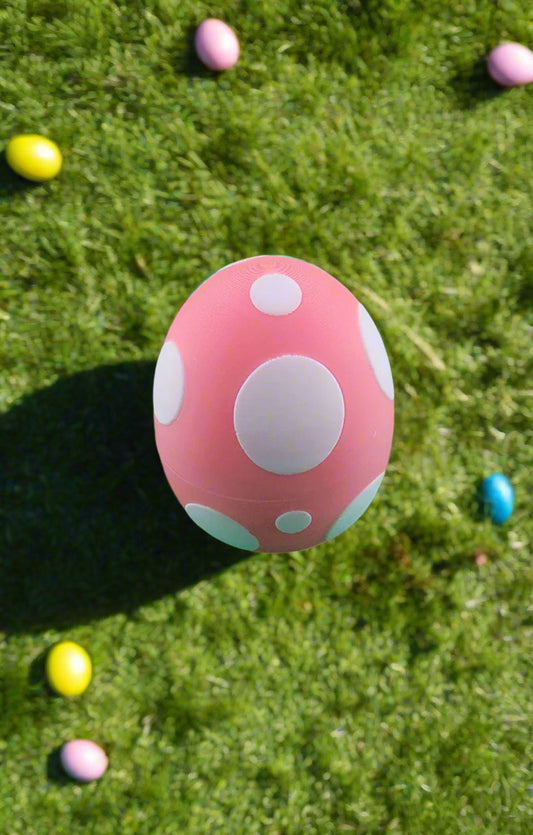 Easter-themed toy egg with white polka dots, part of the Easter Bunny Collection.