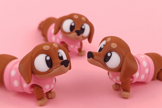 Sausage dog 3d printed with black sweater flexi