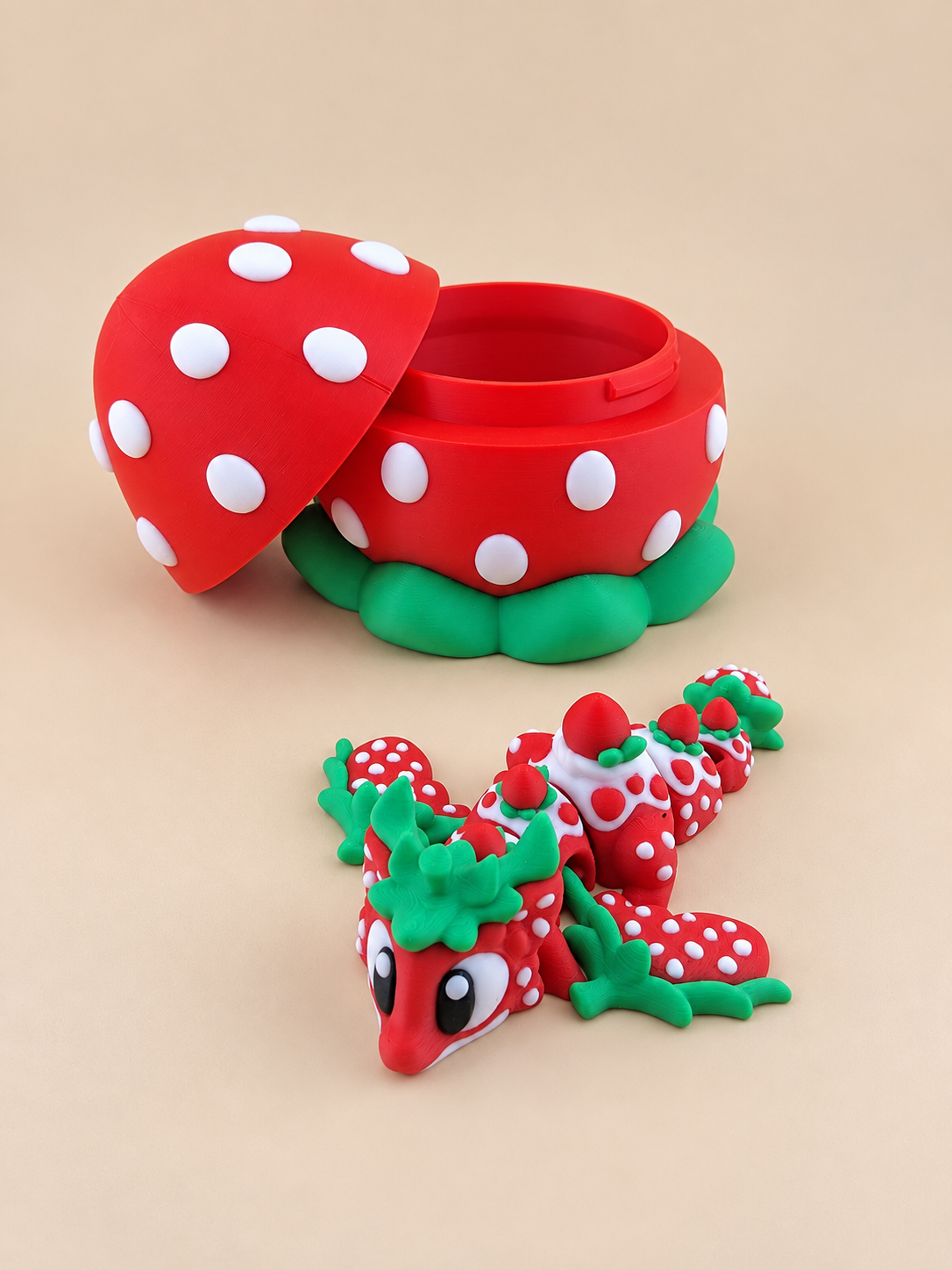 Strawberry Dragon beside its open red and white strawberry egg